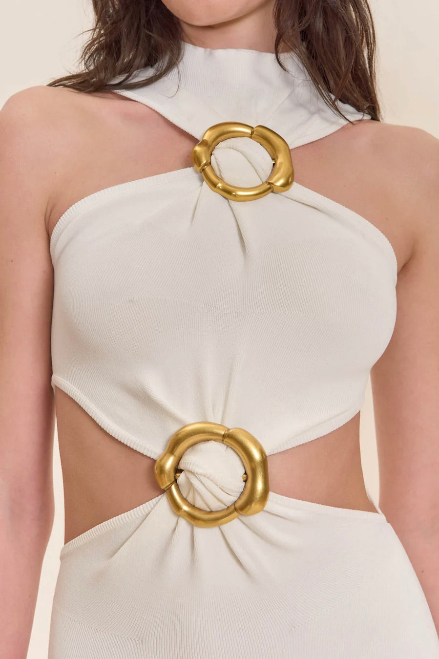 cult gaia ambar knit dress Sky in CULT GAIA's Ambar Knit Dress a statement silhouette with gleaming gold hardware and artful cutouts